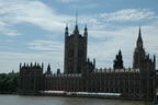 The Victoria Tower segment of the Houses of Parliament from across the River Thames.