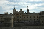 The Tower of London with the top of the White Tower pushing its way above the walls.