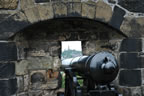 Looking past the cannon to Nelson Monumnet on Calton Hill.
