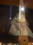 Luxor spire through glass with the pyramid and Sphinx reflecting from behind the camera